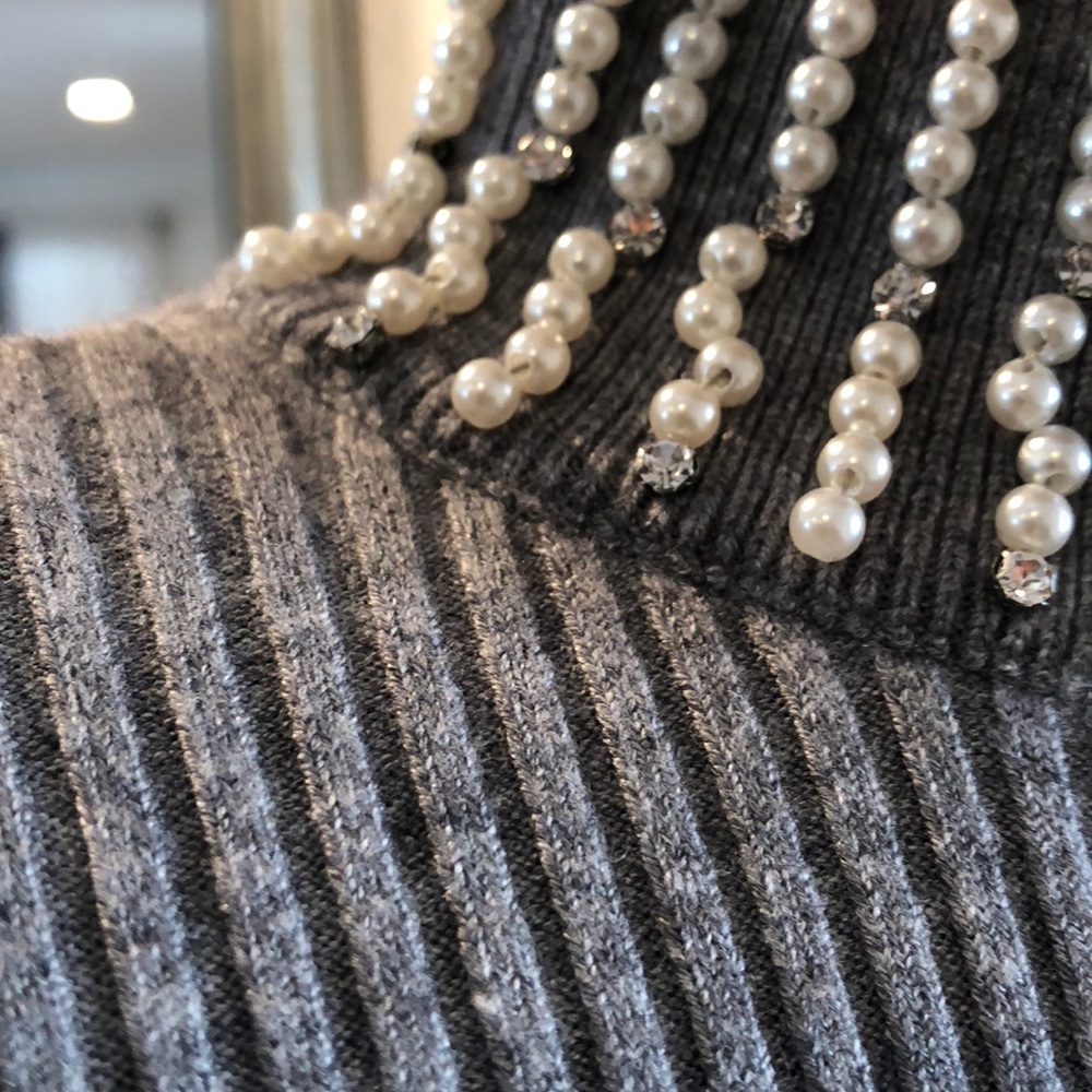 Gray sweater with faux pearl mock turtleneck.